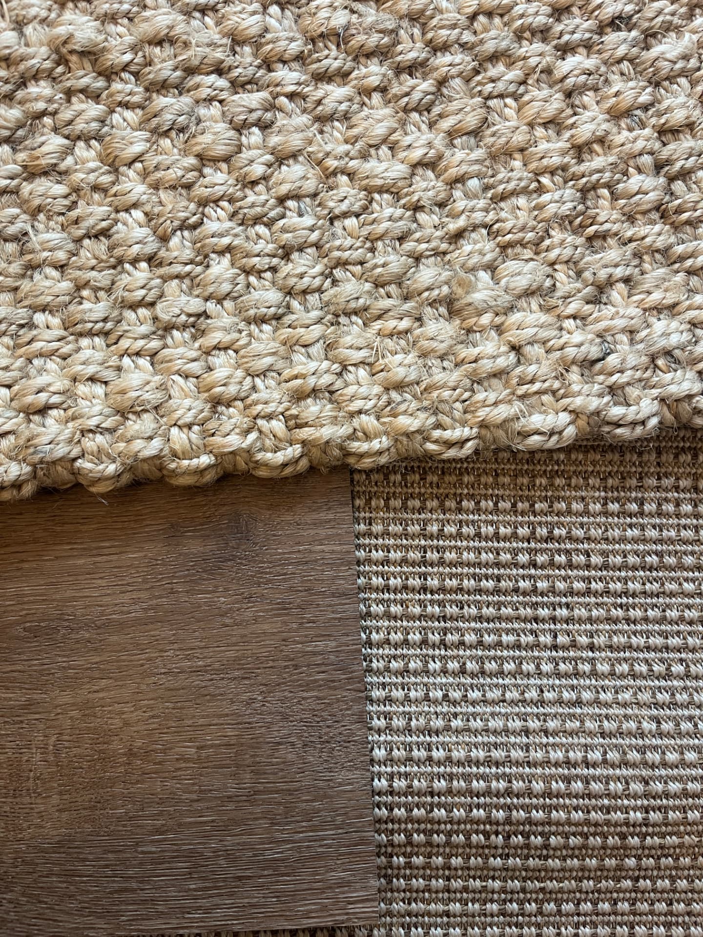 Chunky jute and flat-woven sisal rug samples on timber flooring