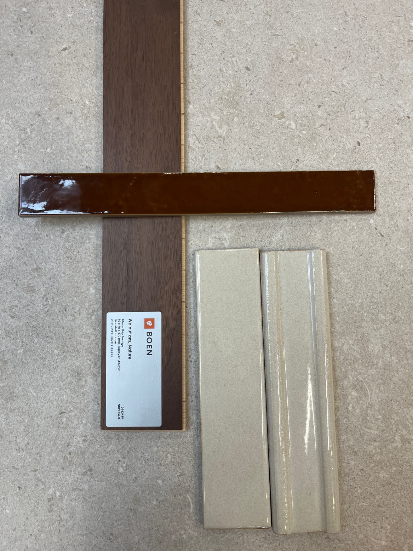 Walnut timber flooring, glossy caramel tile and stone finish samples