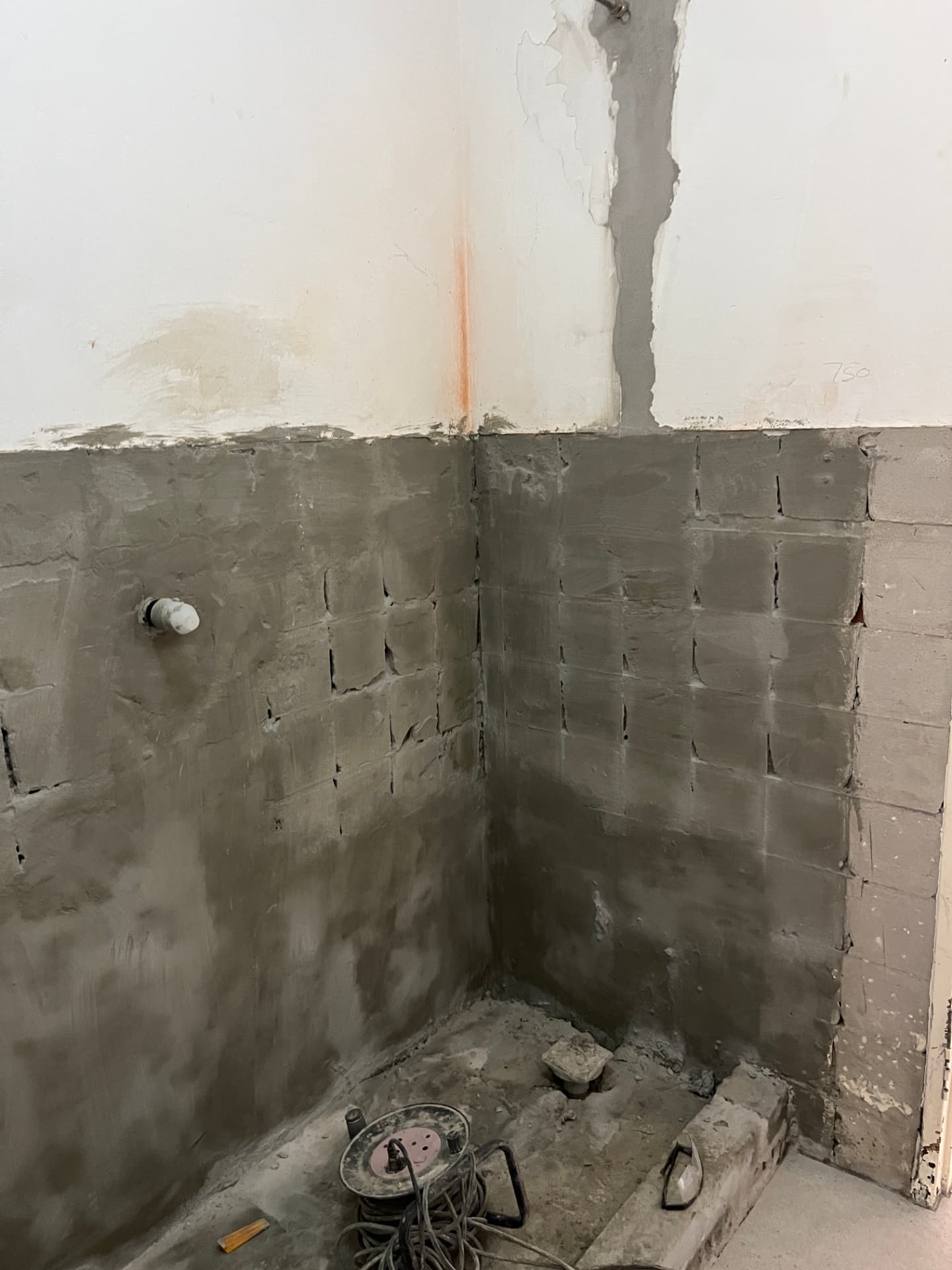 Newly plastered shower recess ready for waterproofing and tiling