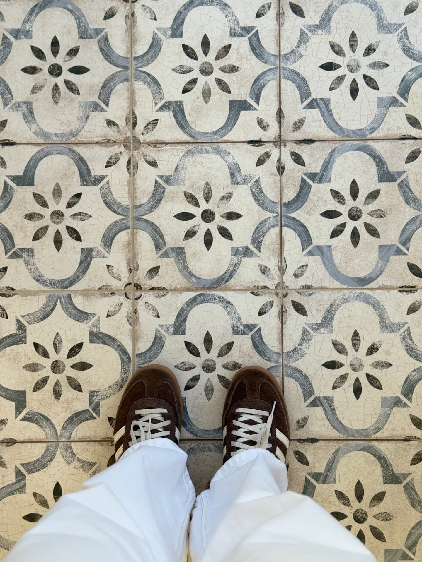 Detail of the patterned blue and cream cement floor tiles
